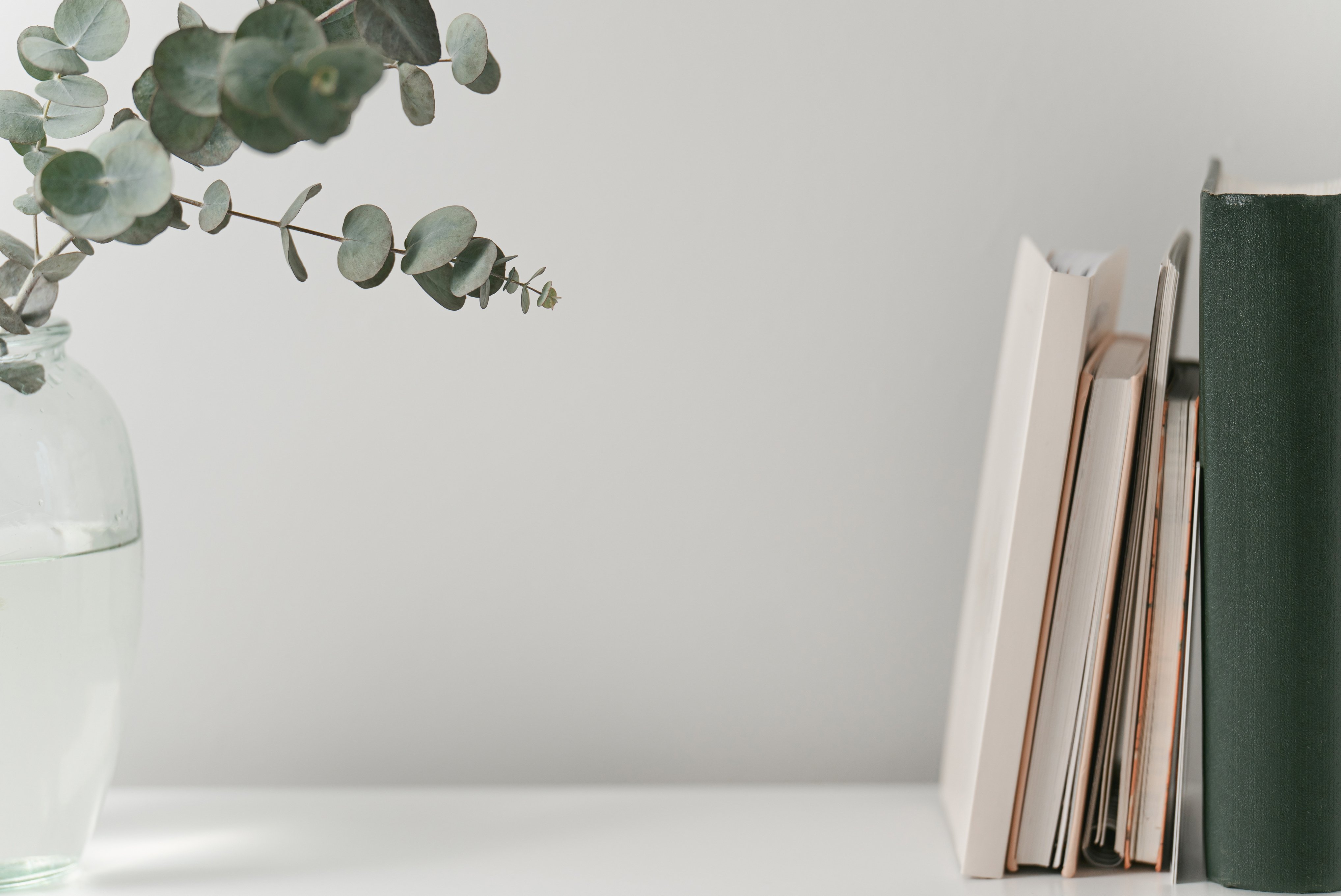 Minimal desk top with books and notebooks, aesthetic office